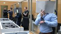 (g-d) Trois ressortissants Ukrainiens, Daniil B., Vladyslav T. et Yevhen B., poursuivis pour avoir aidé les services secrets russes à des fins de sabotages à l'explosif, attendent leur verdict au tribunal régional de Stuttgart-Stammheim, dans le sud de l'Allemagne, le 18 août 2026