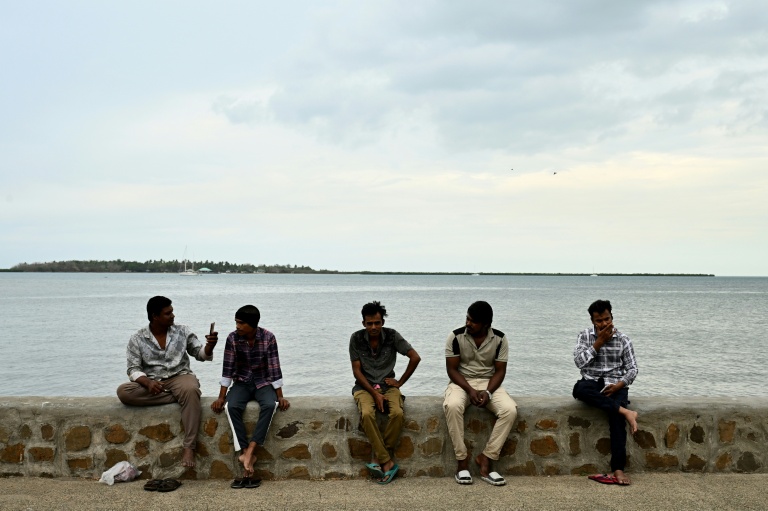 Residents spend their morning on a beach next to the port in Nadi on October 4, 2026, ahead of the Pacific Pre-COP31 Summit's opening ceremony.