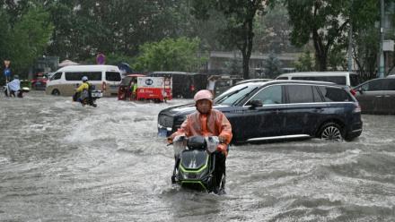 Torrential rain and flooding killed six people and forced at least 130,000 to evacuate in China's Guangxi region