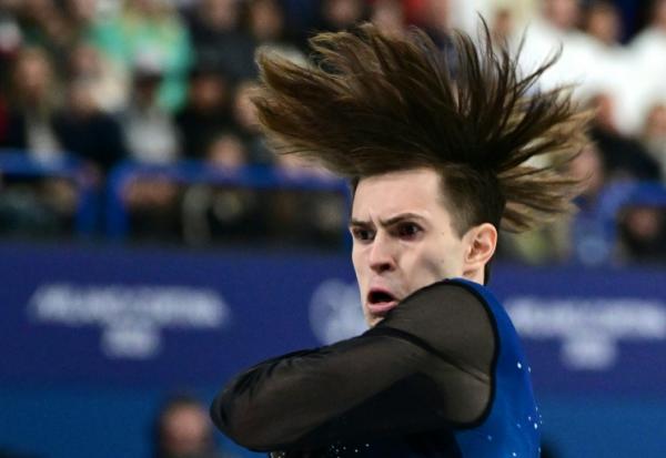 Mikhail Shaidorov lors de son programme libre de patinage artistique le 13 février 2026 sur la patinoire de Milan
où le Kazakhstanais a été sacré champion olympique au terme d'une soirée où le favori américain Ilia Malinin est passé au travers

