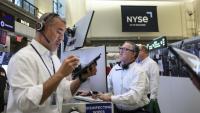 Des traders à la  Bourse de New York le 27 mai 2026