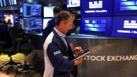 Trader sur le parquet du New York Stock Exchange (NYSE), le 14 mai 2026