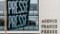 Une banderole presse devant le siège de l'Agence France Presse (AFP) à Paris, le 9 décembre 2024