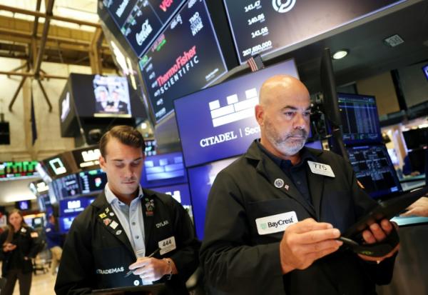 Des opérateurs à la Bourse de New York le 15 août 2025