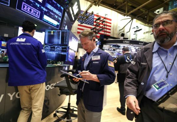 Des opérateurs à la Bourse de New York, le 12 mars 2026