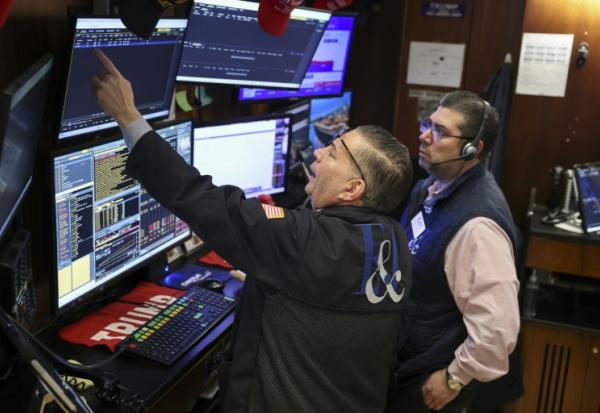 Des opérateurs à la Bourse de New York, le 18 mars 2026
