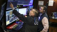 Des opérateurs à la Bourse de New York, le 18 mars 2026