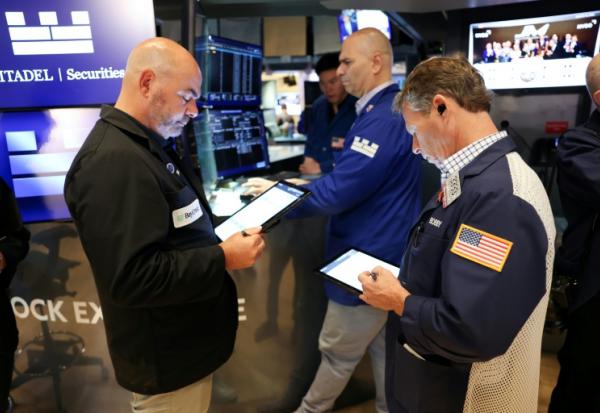 Des opérateurs à la Bourse de New York le 15 août 2025